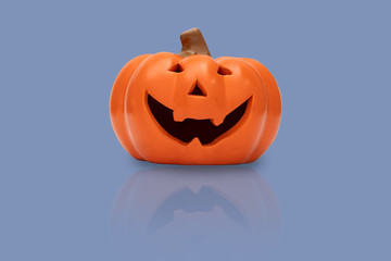 Halloween pumpkin on blue background. Halloween idea concept
