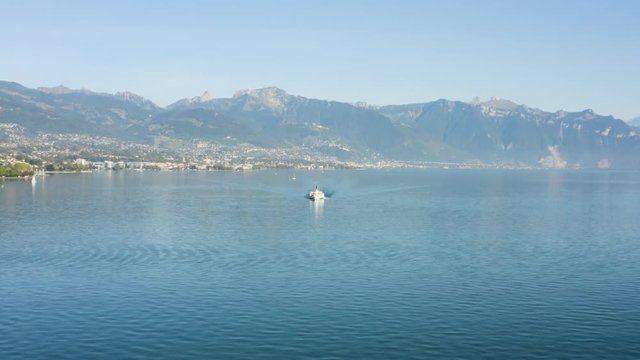 Flying towards Belle-Epoque steam boat on Lake L&radic;&copy;man with Vevey, Montreux and the Alps in the background - Switzerland