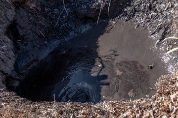 Bubbling hot mud pool in Rotorua, New Zealand