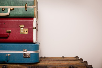 Vintage Suitcases Sitting on Old Wooden Trunk, Room for Text