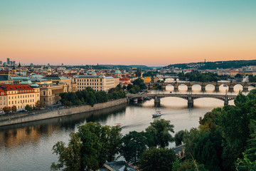 Fototapeta na wymiar Prague city old buildings and Vltava river with sunset from Letna park in Prague, Czech