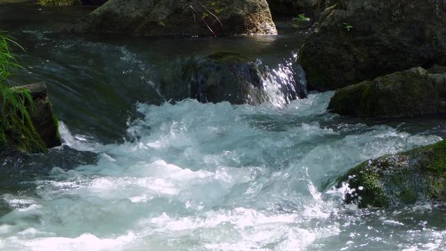 small foam waterfall on the river