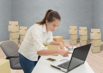 teenager owner business woman work at home with laptop for online shopping writing the order.