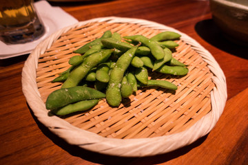 peas in bowl on wooden table