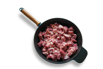 Pieces of raw minced beef in a pan
