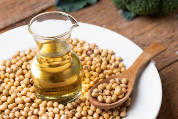 Soy bean and soy oil on  table