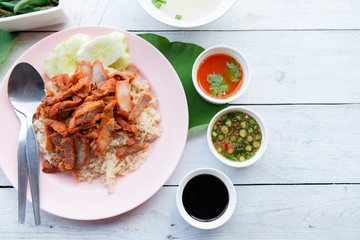 Barbecued red pork in sauce with rice
