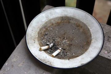 Cigarette butts in plate