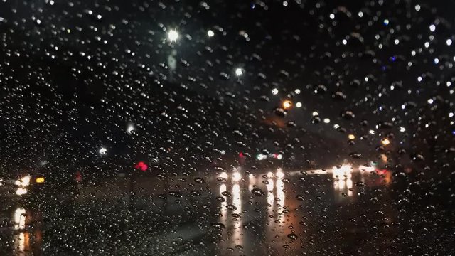 A rainy night on the side of the highway.