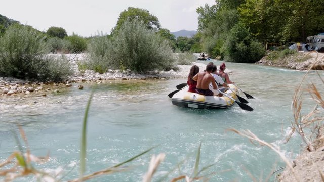 A Group Of People Having Fun At Acheron River. White Water Rafting.