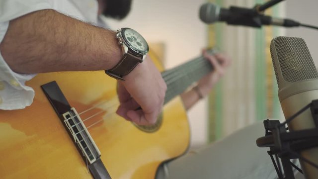 Footage from the hands of a portuguese singer and guitar player