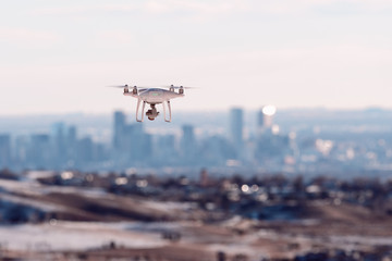 Fototapeta na wymiar Drone hovers over Denver city skyline at sunrise