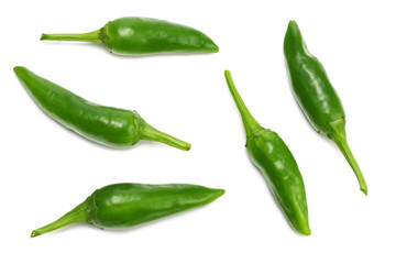 green hot chili peppers isolated on white background top view