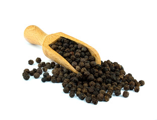 Black pepper on wooden scoop isolated on white background
