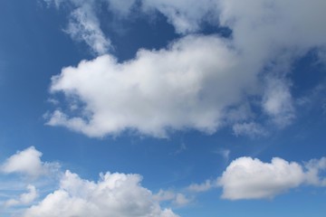 Naklejka na ściany i meble Blue sky with clouds on a sun day