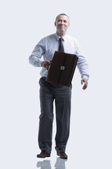 modern business man with a briefcase going forward