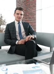 young businessman working with laptop at office