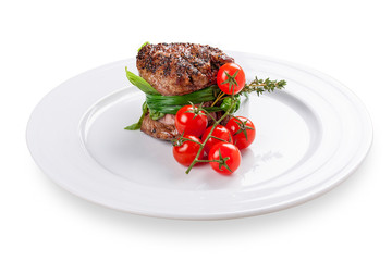 Fillet mignon with cherry tomatoes. On a white background