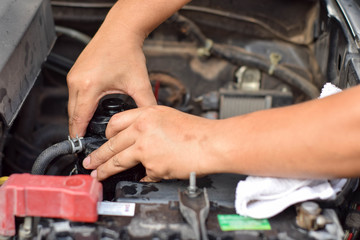 Engineers are repairing engines with tools.