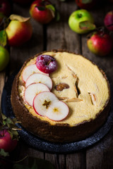 Apple Cheesecake with a Brown Butter Crust. .Dark rustic photo