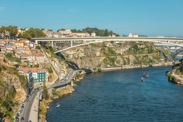 Fototapeta na wymiar Porto, Portugal. Beautiful sunny day of the Douro river 