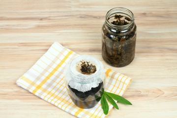 Filtering of plantain syrup against cough / Homemade ribworth plantain (Plantago lanceolata) syrup...