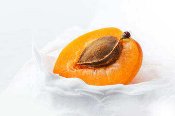 Yogurt with Fresh delicious apricot. Half of juicy apricot in yogurt