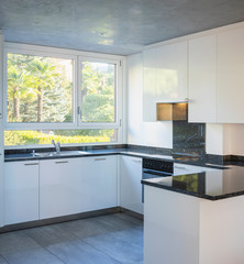 Modern white kitchen with marble top