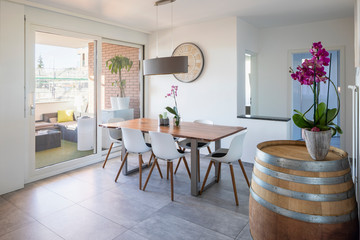 Design dining room with orchids and terrace