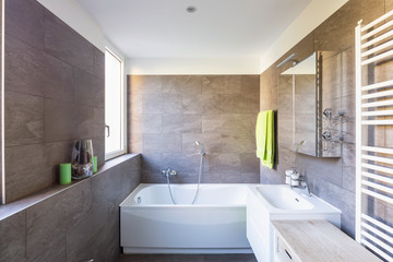 Fototapeta na wymiar Elegant bathroom with dark tiles