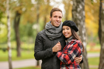 Loving young couple on romantic date in autumn park