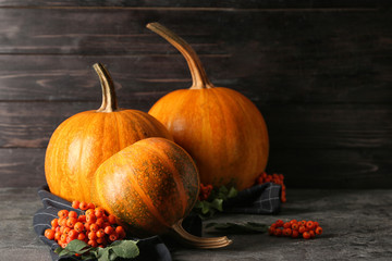 Whole fresh pumpkins on grey table