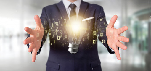Businessman holding a bulb lamp idea concept with data all around 3d rendering