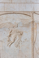 Wall with broken sculpture in the ruins of Pompeii, Italy