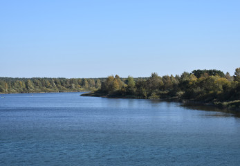 Fototapeta na wymiar Panorama of the lake with greenery.