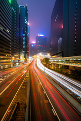 Fototapeta na wymiar Abstract cityscape traffic background with motion blur