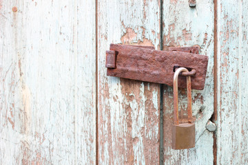 Old key lock on wooden wall in vintage tone concept of safe and private life 