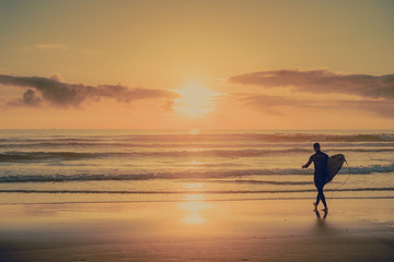 Fototapeta na wymiar Surfer at Sunset
