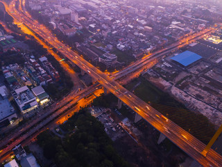 Aerial view of highway junctions. Bridge roads shape letter x cross in structure of architecture...