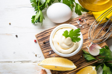 Mayonnaise sauce on white stone table. 