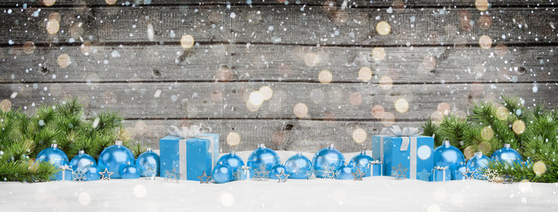 Blue christmas baubles and gifts lined up 3D rendering