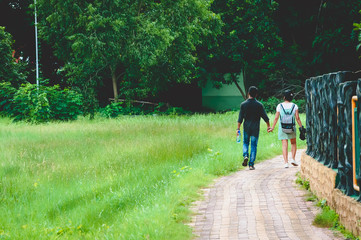 Fototapeta premium Couple walking in a park
