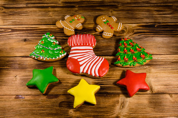 Different christmas gingerbread cookies on wooden table