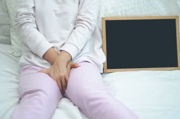 Woman wearing pink pants the itching on vaginal. Genital itching caused by fungus in...