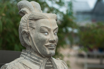 Fototapeta na wymiar closeup of stoned statue in japanese garden