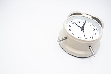 Close up White Alarm Clock isolated Placed on a white background.