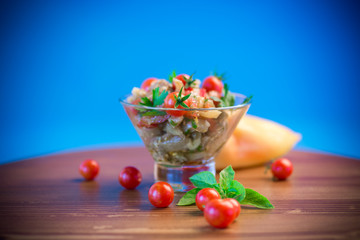 A warm salad of baked eggplant and peppers with cherry tomatoes