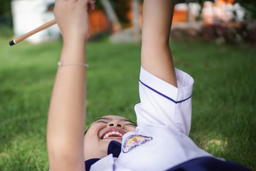 Portrait of a little girl in Thai student uniform.