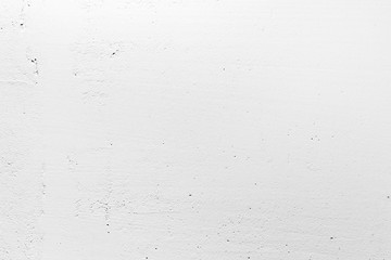 White wall of porous material. Light uneven surface with small holes and cracks. Texture of old...
