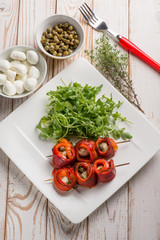 capsicum stuffed with mozzarella and capers with arugula salad